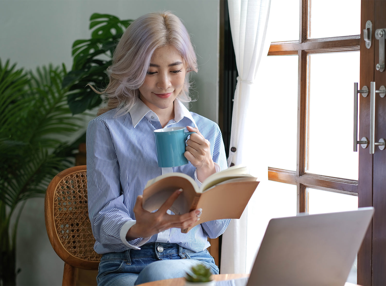 Nourished Self-care ideas blog, woman reading book siting down